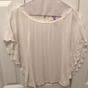Francesca’s white embroidered blouse